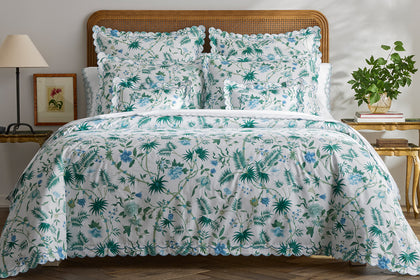 Palmyra tropical floral bedding styled on a bed.