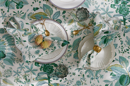 Pomegranate botanical table linens, set overhead.