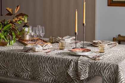 Regine zebra-print tablecloth set for a dinner party.