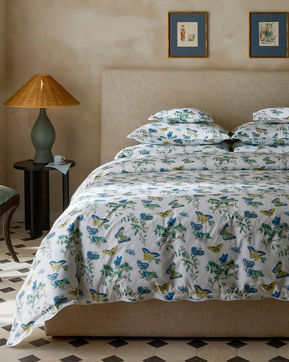 Baudin Butterfly print bedding with blue, yellow, and green butterflies and florals.