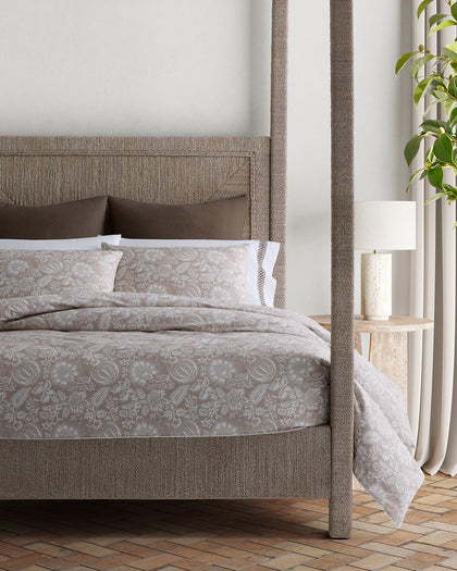 Tan Granada floral print bedding styled on a bed.