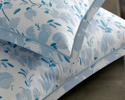Blue Alexandra floral print pillows shown in detail.
