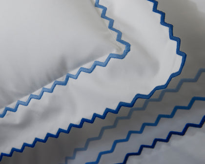 Blue and navy Axel wavy embroidered trim.