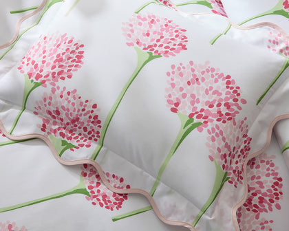 Pink Charlotte allium-print quilted bedding.