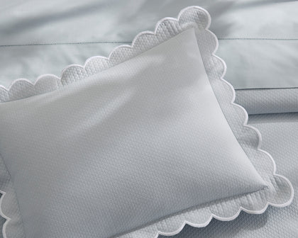 Pale blue Diamond Pique scalloped pillow.
