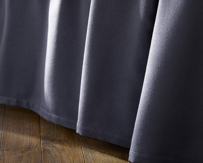 Charcoal Dream Modal sheet draped over a bed.