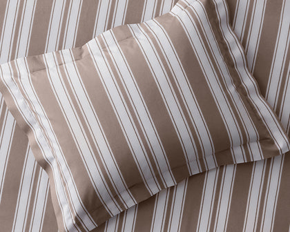Tan striped Elio pillow.
