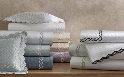 Classic Chain matelassé shams and sheets with chain-embroidery trim in multiple colors