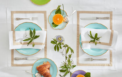 Lowell table linens with tan borders set for breakfast