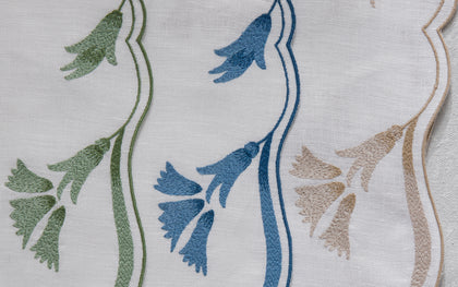 Close-up of Marcella scalloped floral embroidery in three colorways
