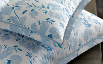 Blue Alexandra floral print pillows shown in detail.