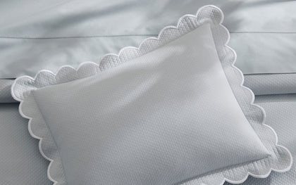 Pale blue Diamond Pique scalloped pillow.