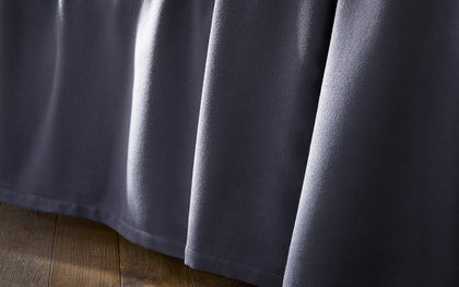 Charcoal Dream Modal sheet draped over a bed.