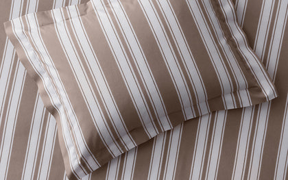 Tan striped Elio pillow.