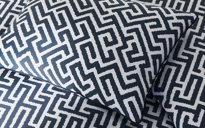 Navy and white Gabriel fretwork print pillows.