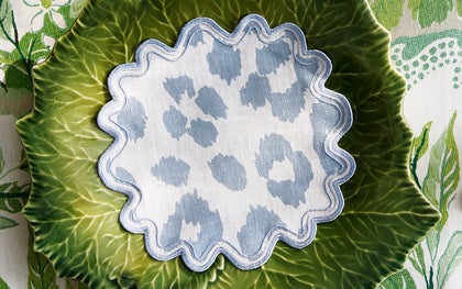 Blue Iconic Leopard print scalloped coaster set on a green cabbage-shaped plate.