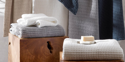 Nico waffle-weave towels in multiple colors with a bar of soap