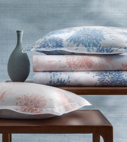 Chrysanthemum floral bedding and pillow display.